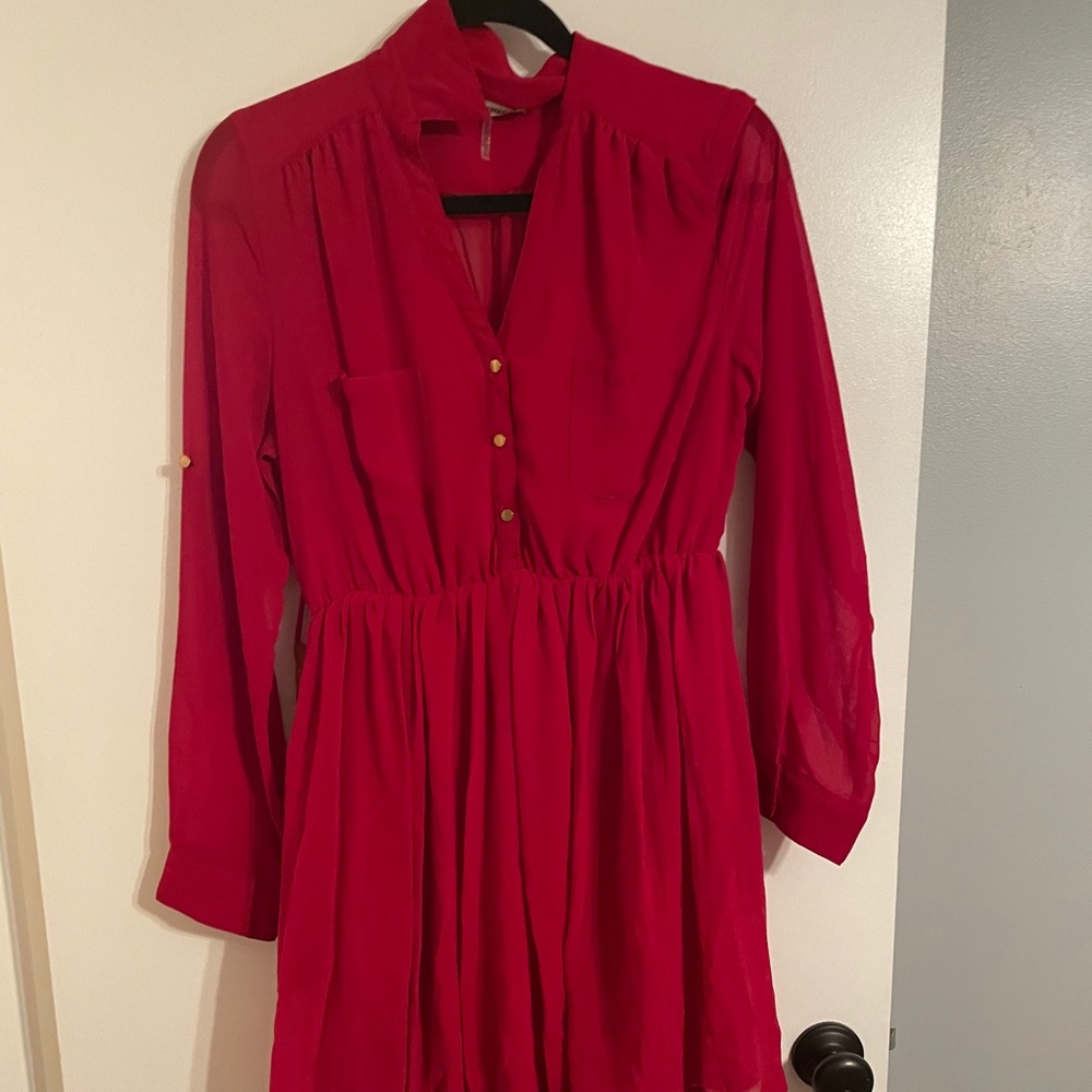 Red long sleeved dress with tan belt